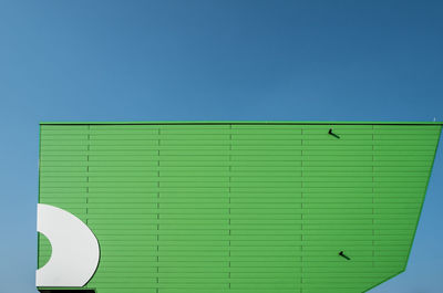 Close-up of built structure against clear blue sky