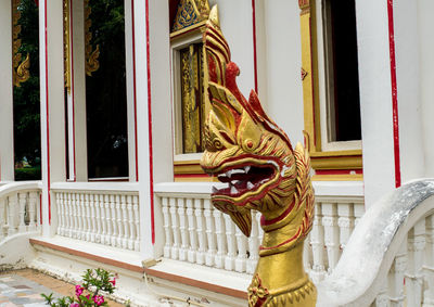 Statue of buddha against building