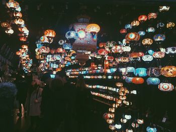 Illuminated chandelier at market stall