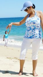 Woman standing on beach