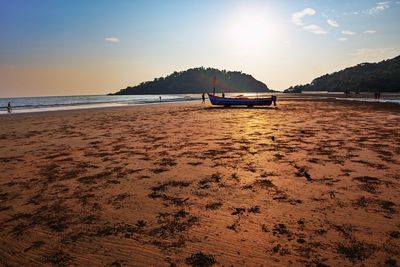 Scenic view of beach against sky during sunset