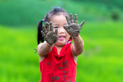 Happy girl very fun play mud