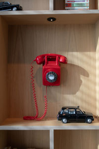 Red toy car on table