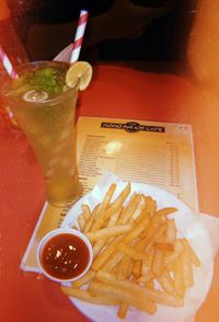 Close-up of food served with drink on table