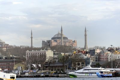 View of city against cloudy sky