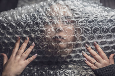 Close-up of woman face covered with plastic