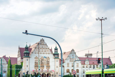 Buildings in city against sky