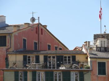 Exterior of building with english flag against sky