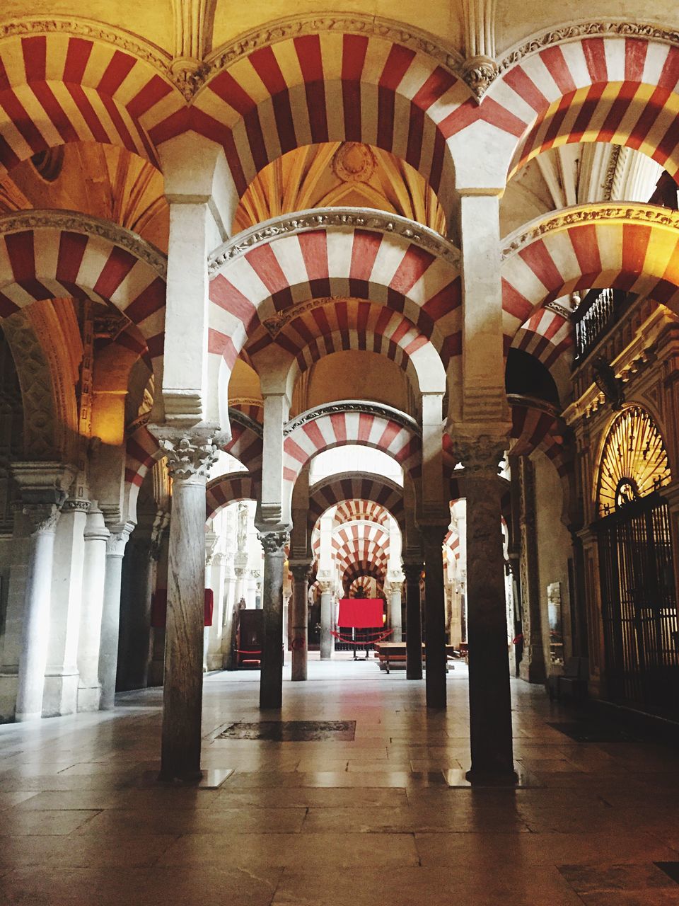 indoors, arch, architecture, built structure, architectural column, corridor, ceiling, column, interior, flooring, place of worship, the way forward, colonnade, religion, archway, empty, entrance, architectural feature, history, spirituality