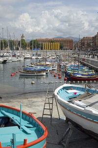 Boats moored at harbor