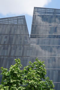 Low angle view of office building against sky