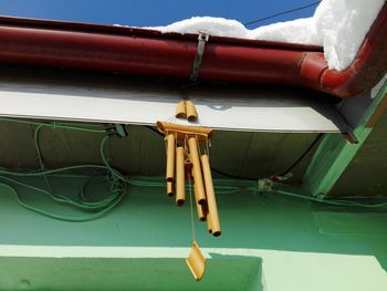 Low angle view of clothes hanging on roof