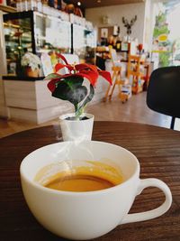 Close-up of coffee cup on table