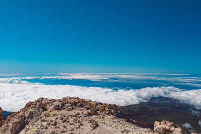 Scenic view of rocks against blue sky