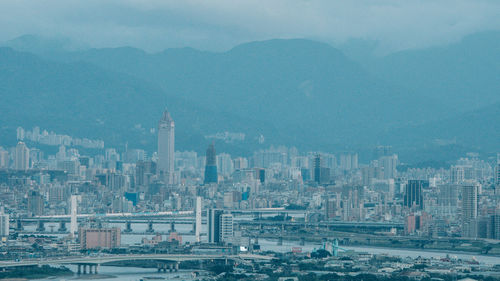 Aerial view of cityscape against sky