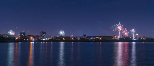 2020 new year colorful fireworks exploding on the sky above lacul morii lake, bucharest, romania