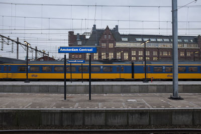 Train on railroad tracks against sky