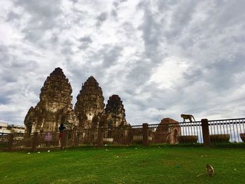 View of temple on field against sky