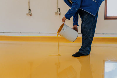 Low section of man standing on floor