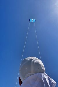 Low angle view of ship against clear blue sky