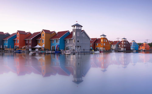 Famous dutch cityscape, reitdiephaven street with traditional colorful houses on water