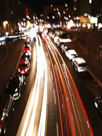 High angle view of light trails on road at night
