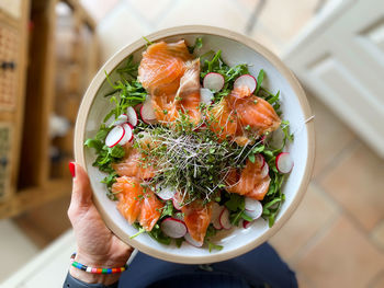 High angle view of hand holding food