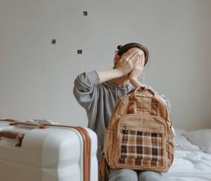Woman with the baggage at home, lost on flight