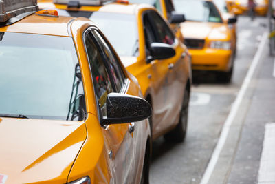 Yellow cabs in manhattan, nyc. the taxicabs of new york city are widely recognized icons of the city