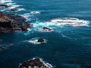 High angle view of rocks in sea