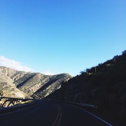 Country road leading towards mountains