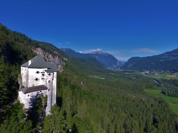 Scenic view of mountains against clear blue sky