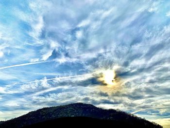 Low angle view of silhouette mountain against sky