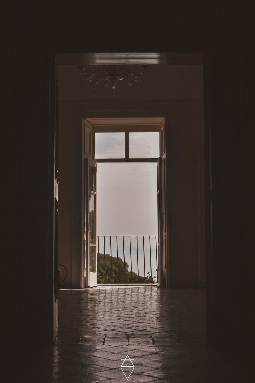 light, architecture, darkness, indoors, house, no people, white, built structure, entrance, black, door, building, day, interior design, window, nature, corridor, arcade, absence
