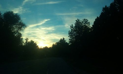 Scenic view of landscape against sky at sunset