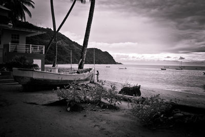 View of swing at beach against sky