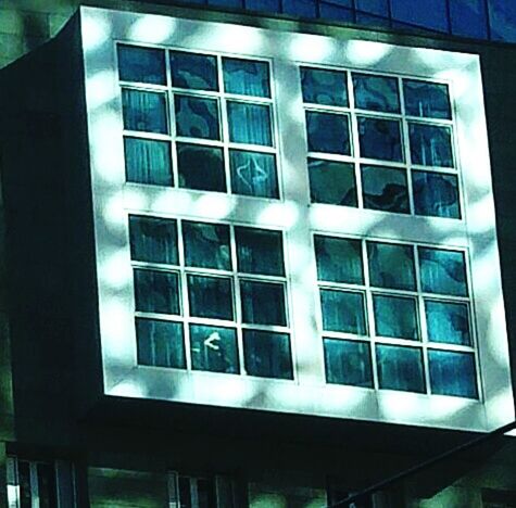 LOW ANGLE VIEW OF WINDOWS ON BUILDING