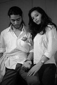 Young couple looking away