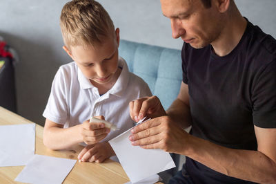 Close-up of man working at home