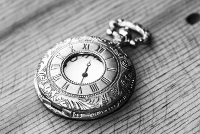 High angle view of clock on table