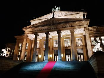 Low angle view of historical building at night