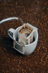 High angle view of coffee cup on table