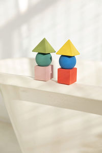 Stacks of toy blocks standing on bathtub rim