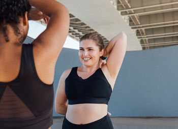 Young woman exercising in gym