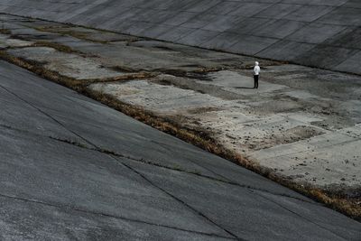 High angle view of man walking on dry riverbed