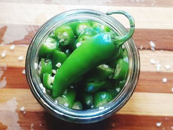 High angle view of vegetables in glass container on table