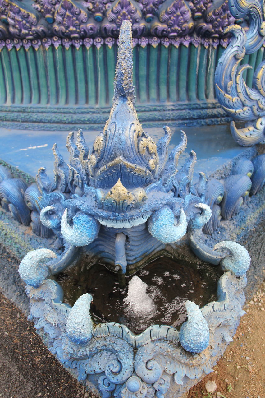 CLOSE-UP OF BUDDHA STATUE IN TEMPLE