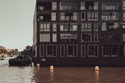 Buildings by river