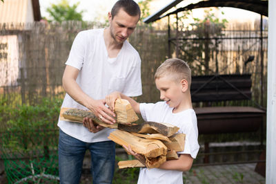 Portrait of man holding snail