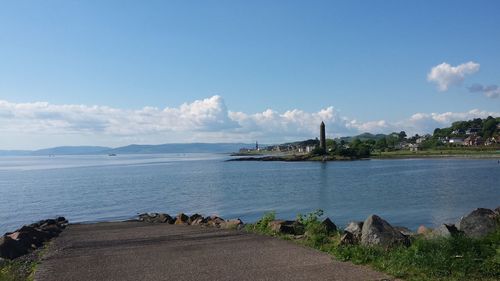 View of calm sea against cloudy sky